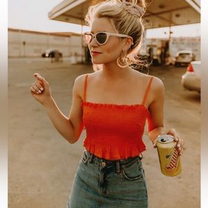 Bebe Orange Smocked peplum top, M